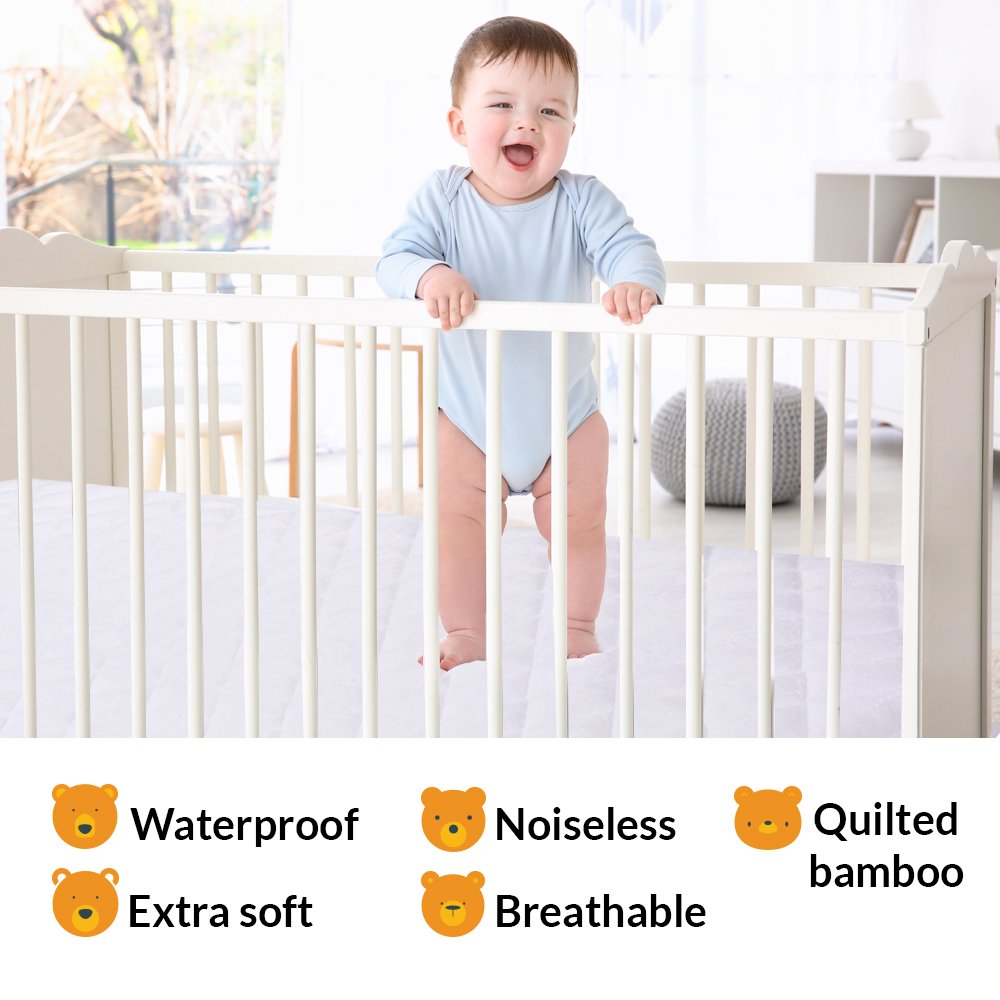 PlushDeluxe mini crib mattress protector waterproof layer protects against spills and accidents