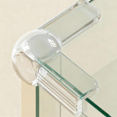PlusOxsteel 12-pack table corner covers shown on a sharp edge for baby safety.