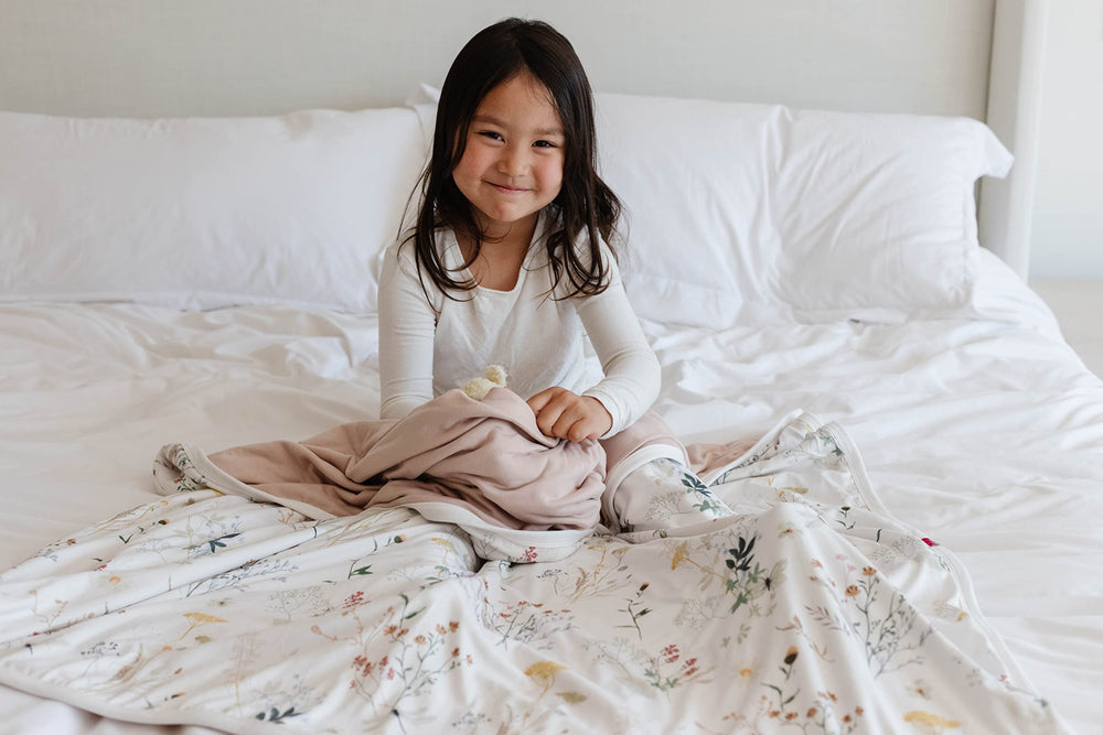 Pobibaby Wildflower blanket folded neatly, a versatile travel companion or nap time essential.