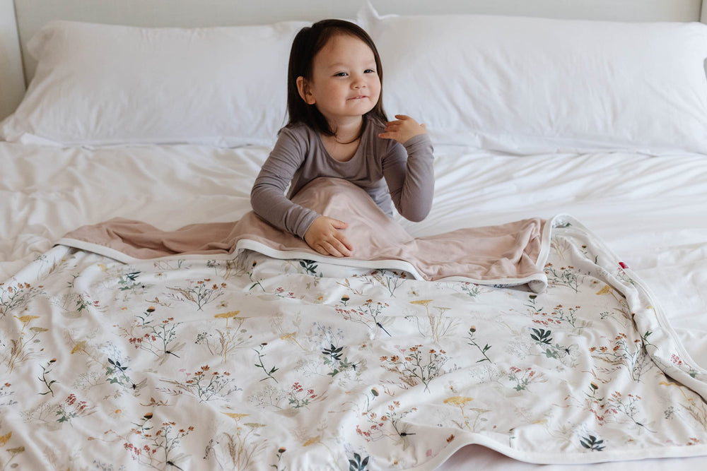 Pobibaby Wildflower blanket for nap time offers three-layer warmth for year round comfort.