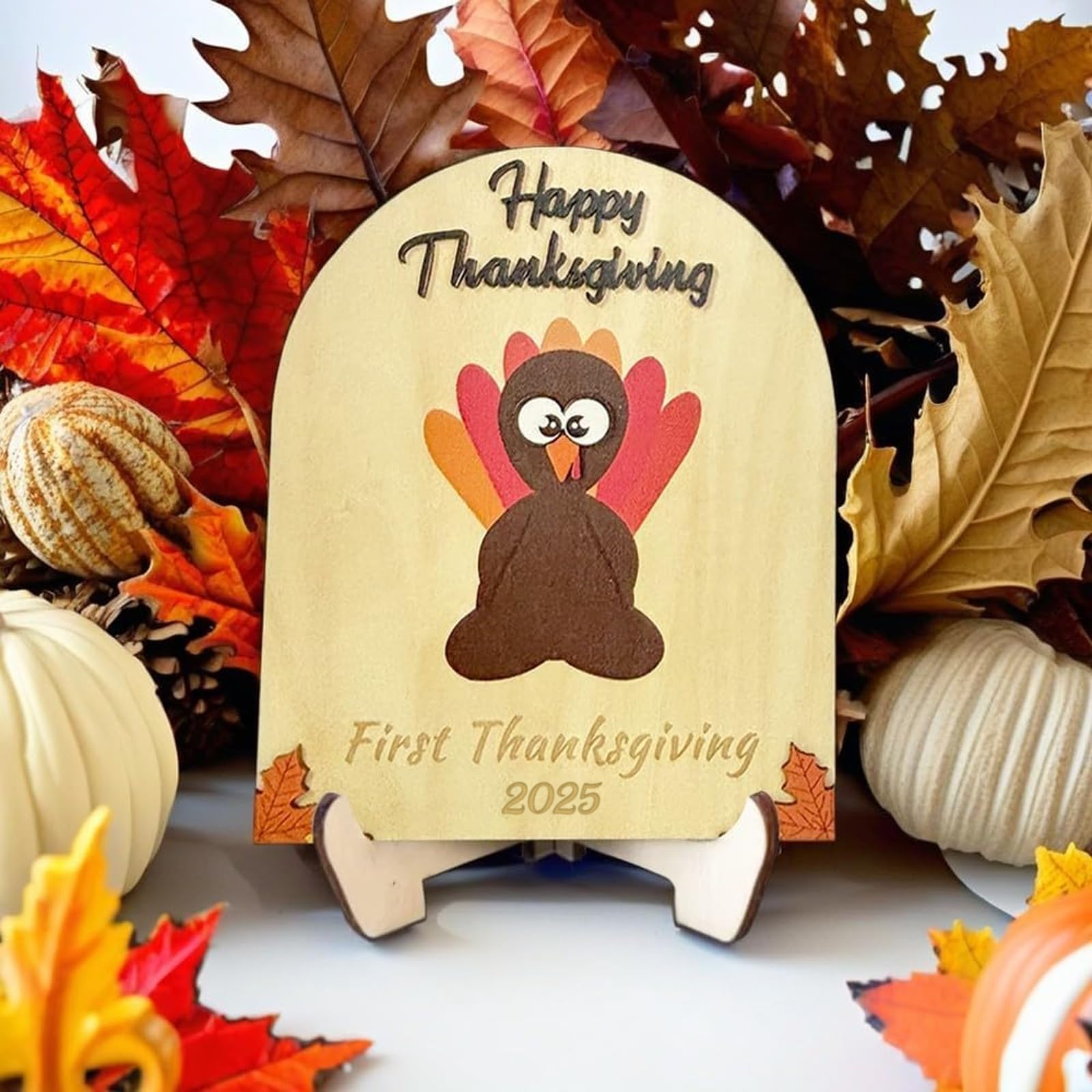 Poceton baby footprint turkey sign captures joyful learning moments.