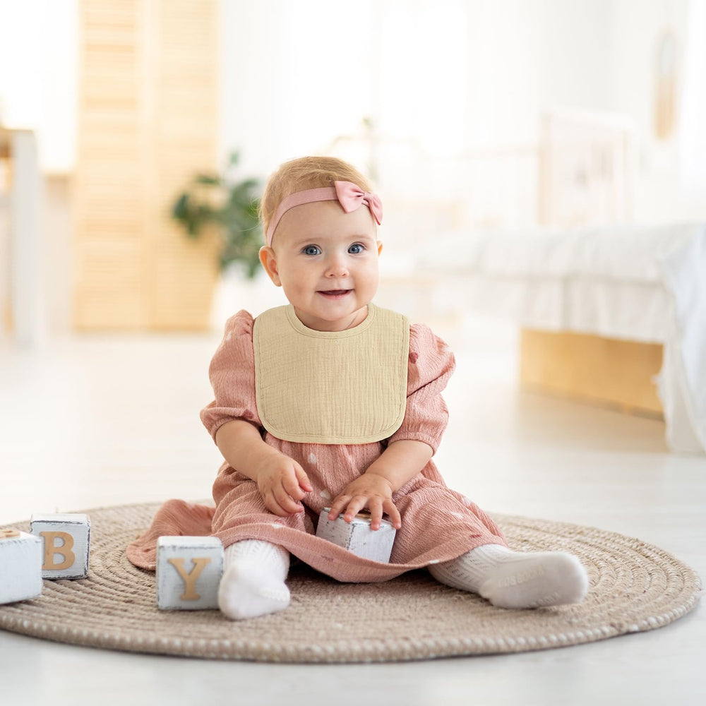 POIKSHARK adjustable-snaps image; two snap sets let bib grow with baby.
