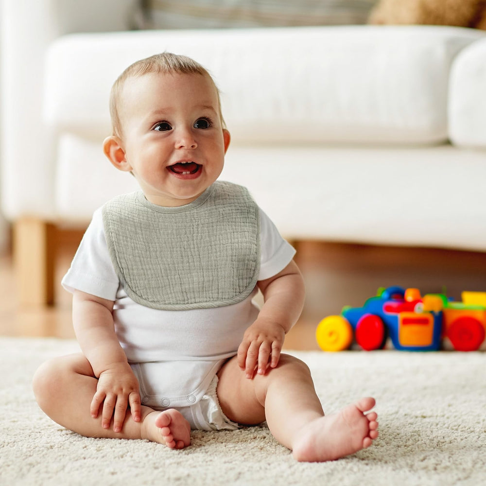 Poikshark adjustable snaps demonstrate size range from newborn to 36 months