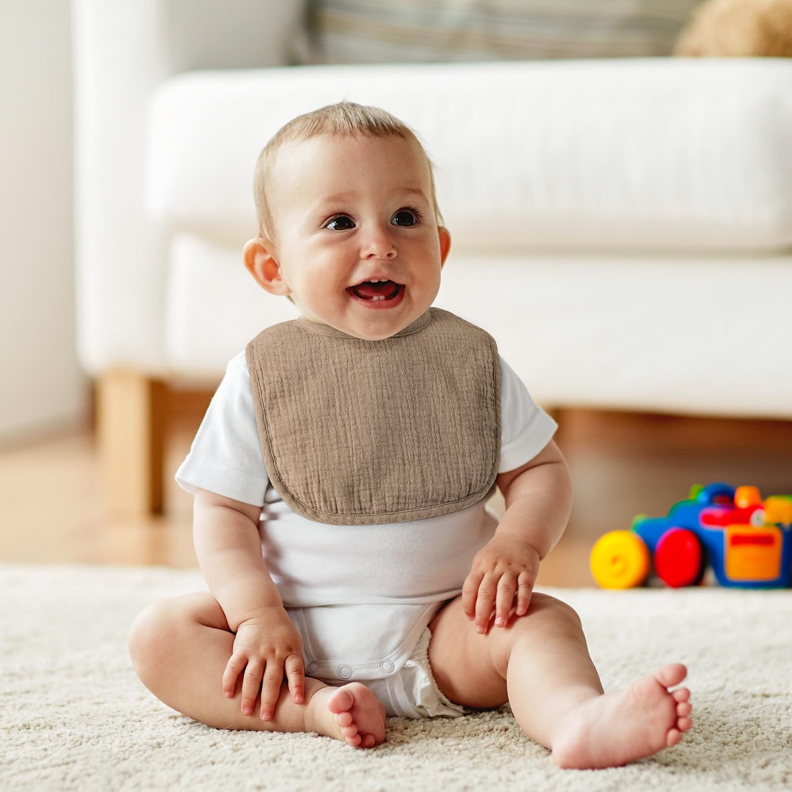 POIKSHARK Muslin Baby Bib on baby during feeding showing spill absorption.