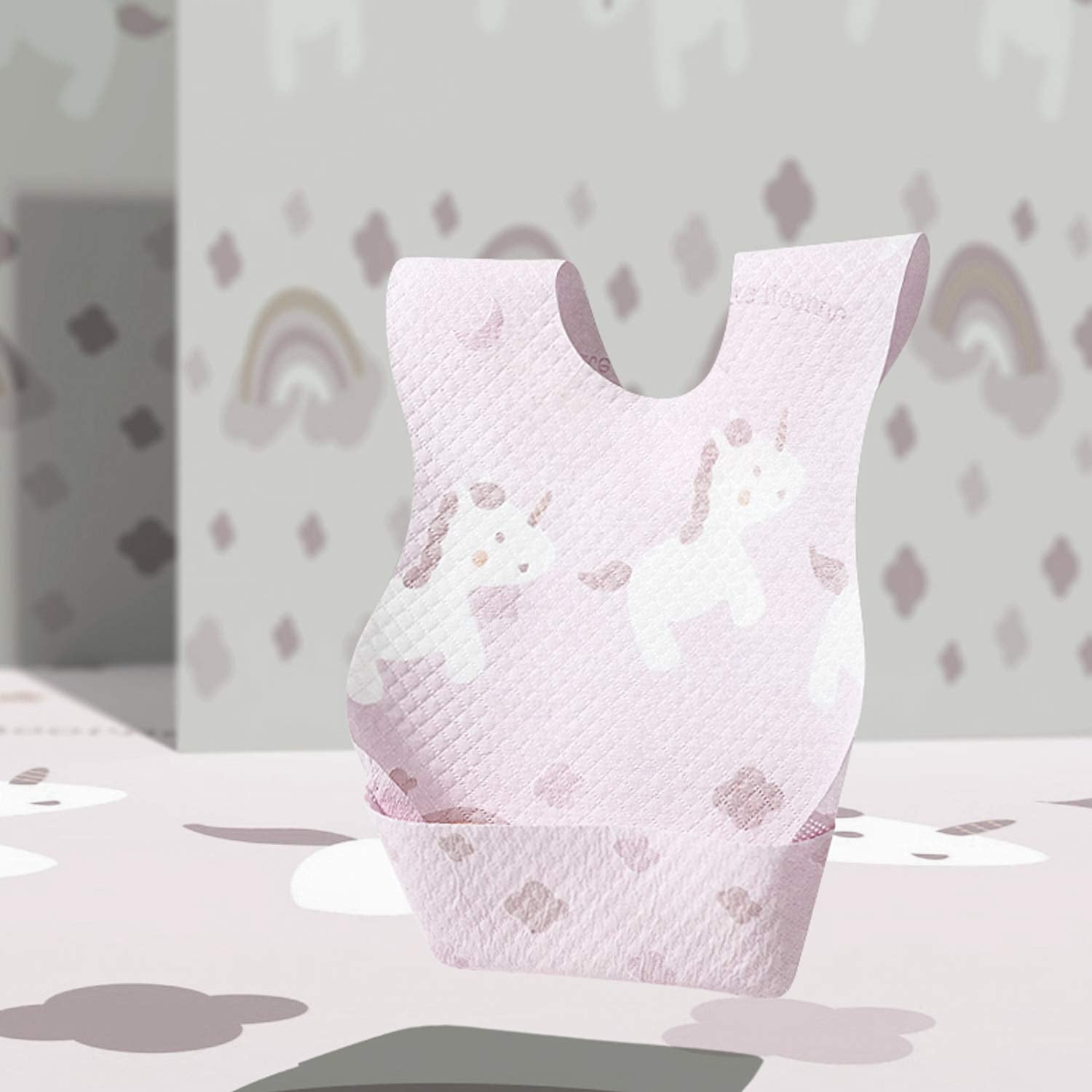 Poksun Unicorn disposable bib lightweight and portable for on-the-go feeding.