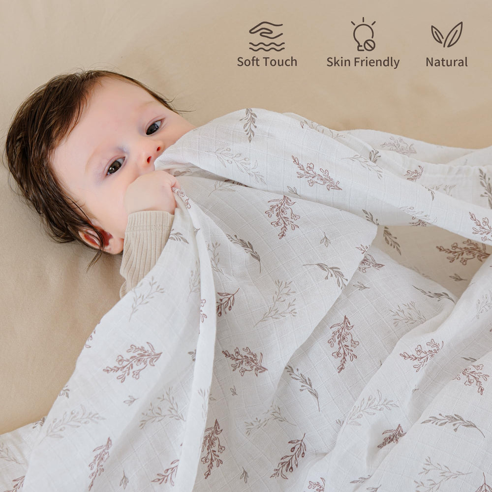 POMISO muslin swaddle blanket warm earth colors highlights cozy tones for calm feeding or naps.