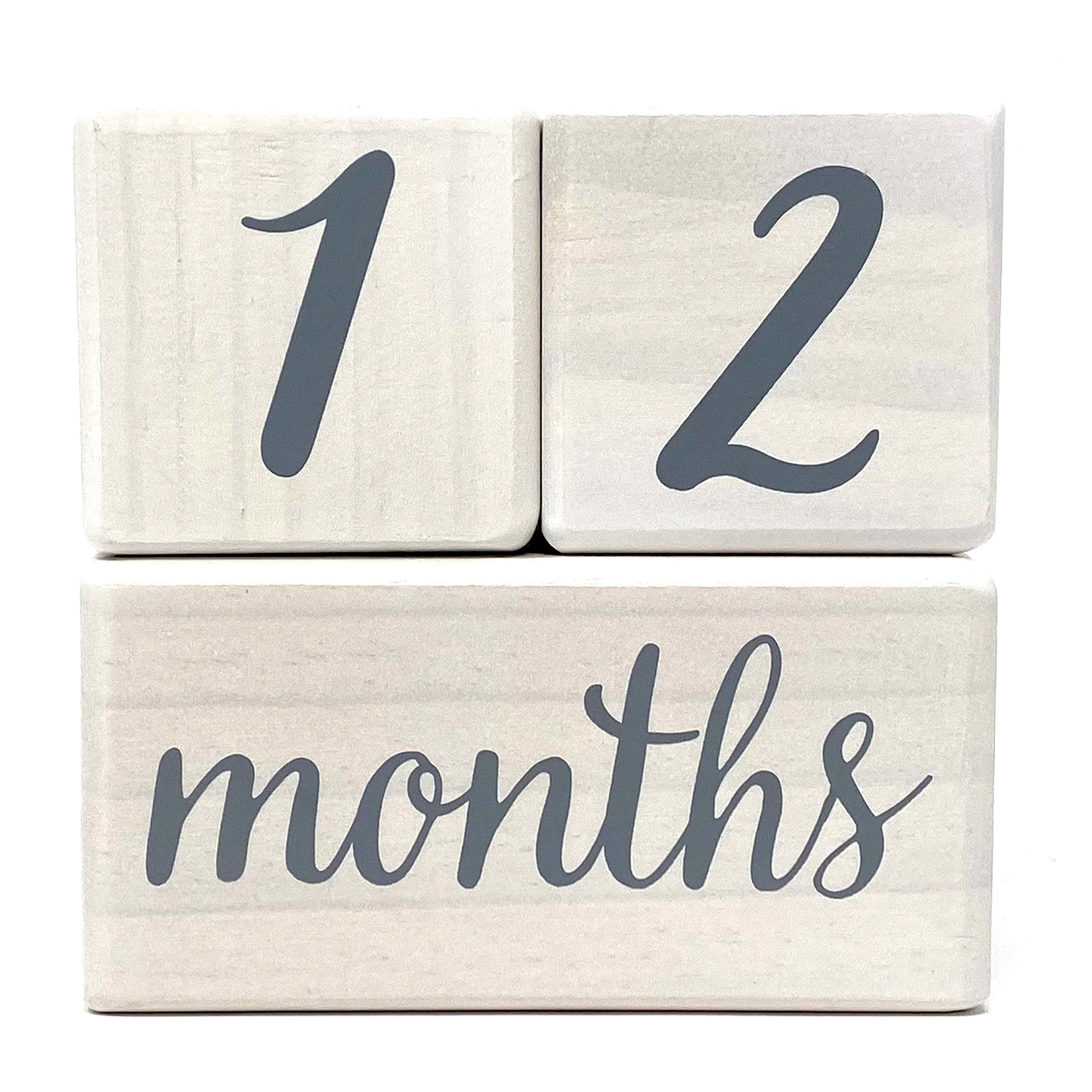Pondering Pine milestone blocks with week labels arranged for weekly growth snapshots.