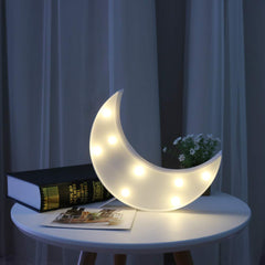 Pooqla Moon marquee bedside night light for gentle illumination.
