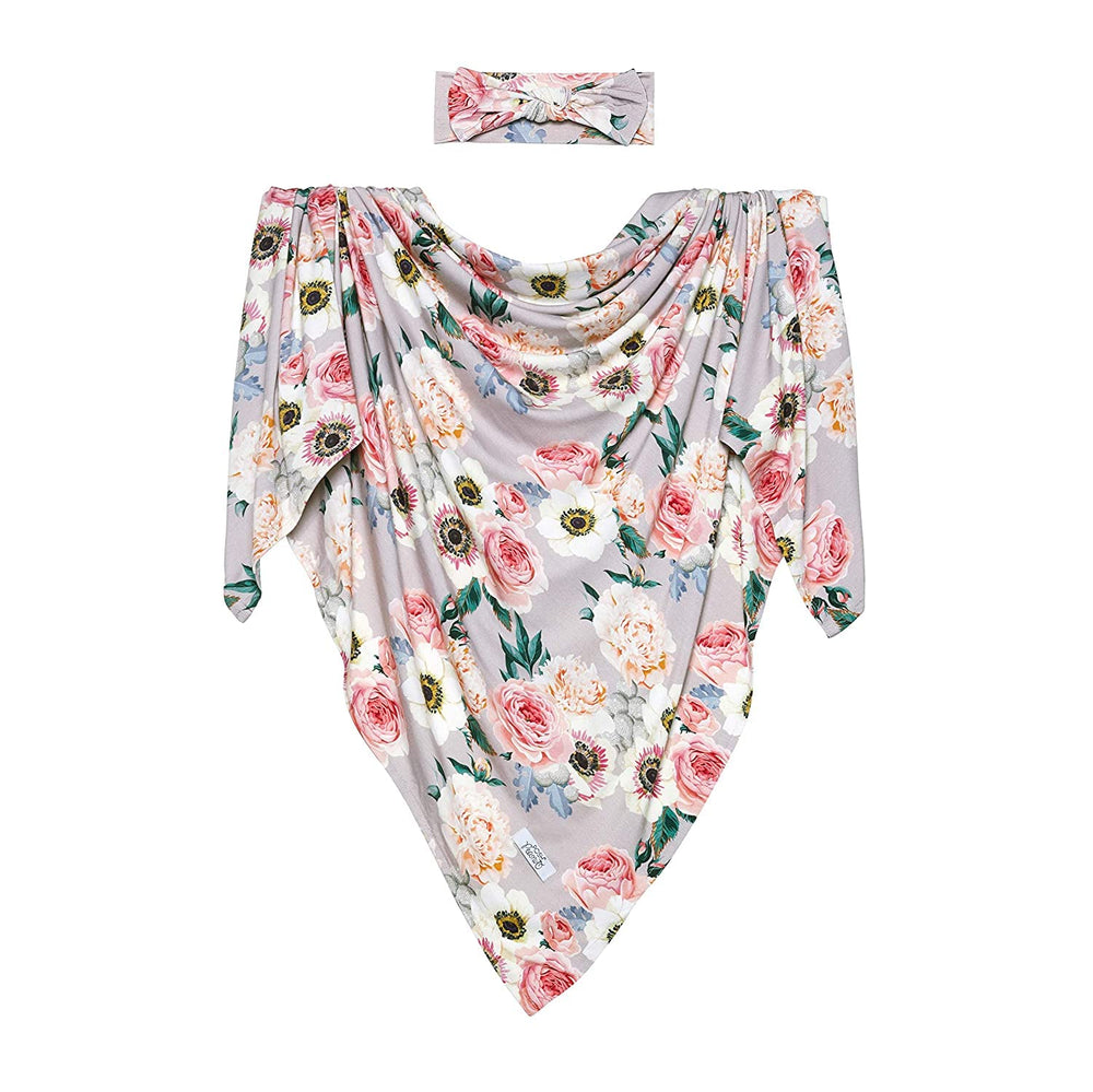 Posh Peanut newborn girl swaddle in use for snug, secure wrapping
