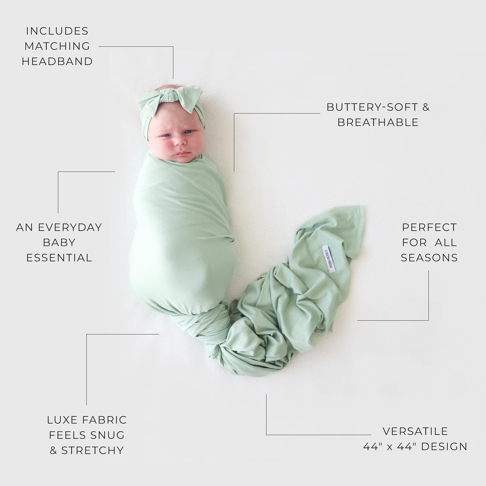 Posh Peanut Sage receiving blanket in stroller demonstrates versatile coverage on strolls.