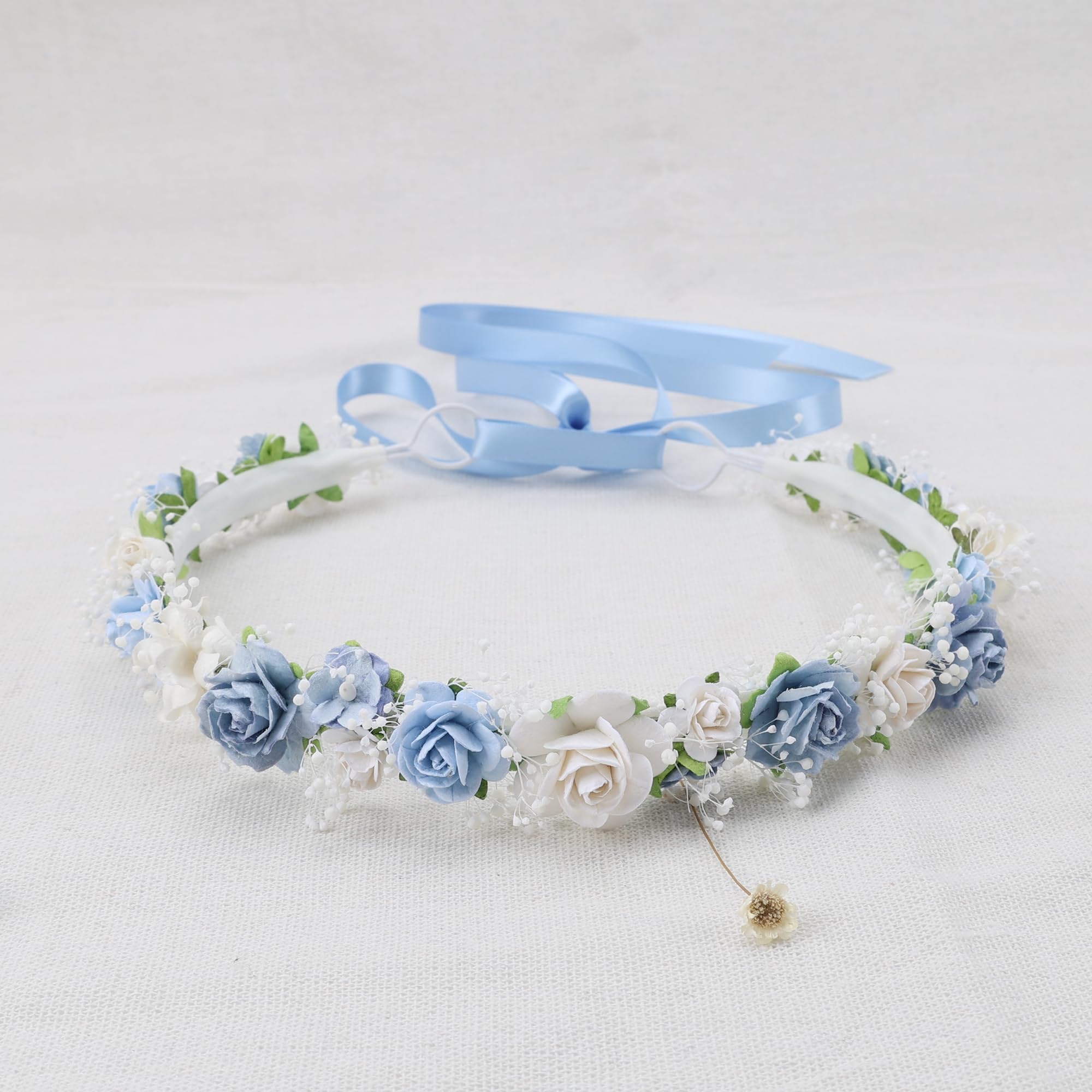 PoshMyra dusty blue crown worn by child for weddings or parties
