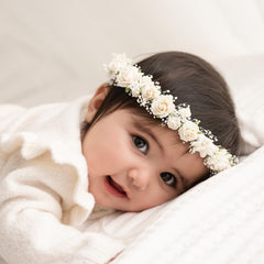 PoshMyra toddler flower crown closeup shows delicate baby’s-breath blooms for timeless photos.
