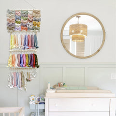 Close-up of POVETIRE organizer rows holding baby headbands in tidy stacks