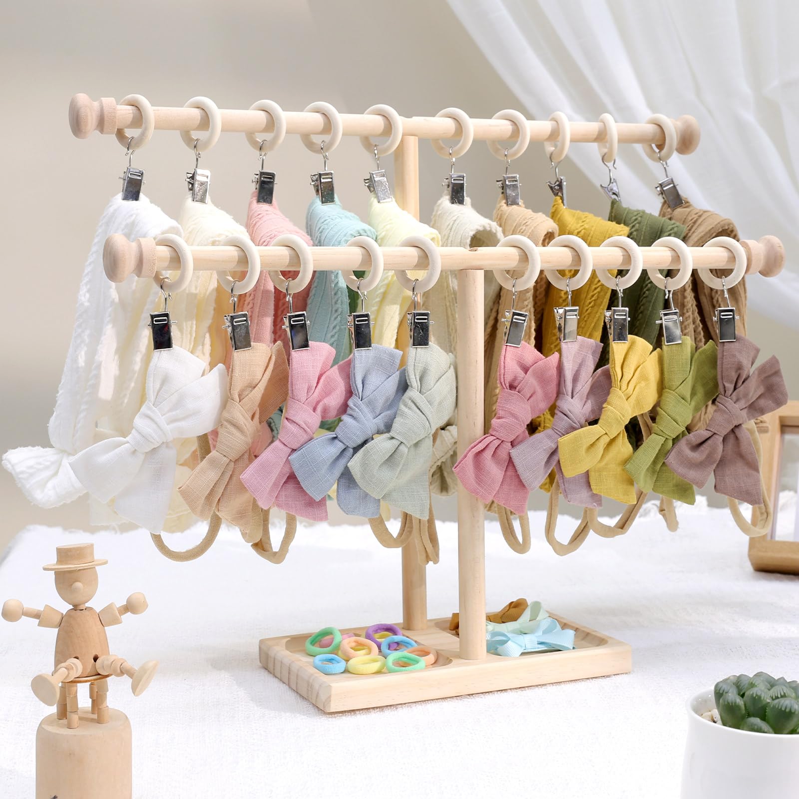 POVETIRE gift-ready holder stacks bows and keeps nursery clutter low