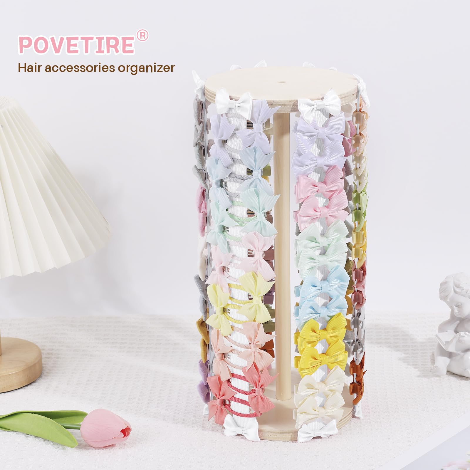 POVETIRE hair bow organizer rack neatly displays accessories on a dresser.