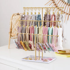POVETIRE headband holder base storage highlights organization of small accessories like hair ties.
