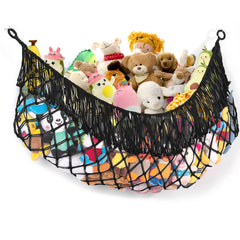 PrimZooty stuffed-animal-hammock on wall helps keep toys organized and accessible.