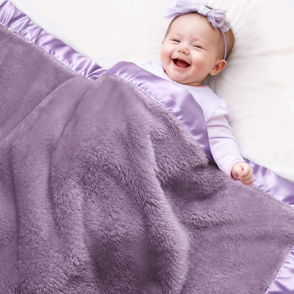 Pro Goleem fleece baby blanket with satin trim in purple for elegant warmth