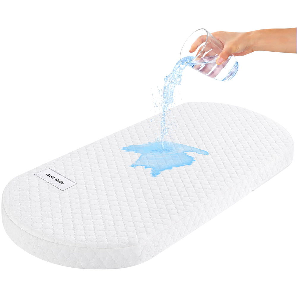 Pro Goleem Oval Mattress Pad front view shows snug bassinet fit and comfortable surface.