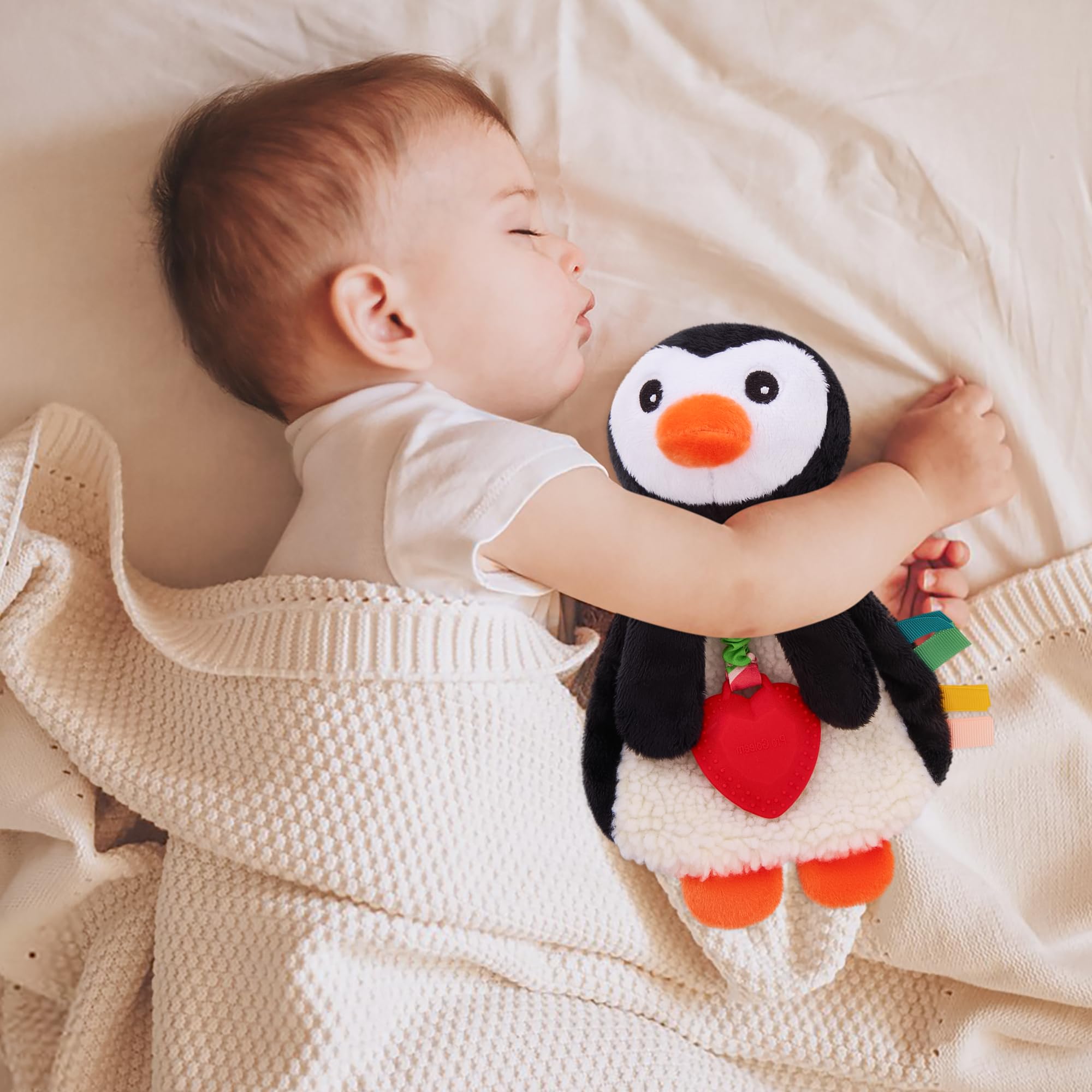 Pro Goleem Penguin Lovey crinkle textures engage senses for early development.