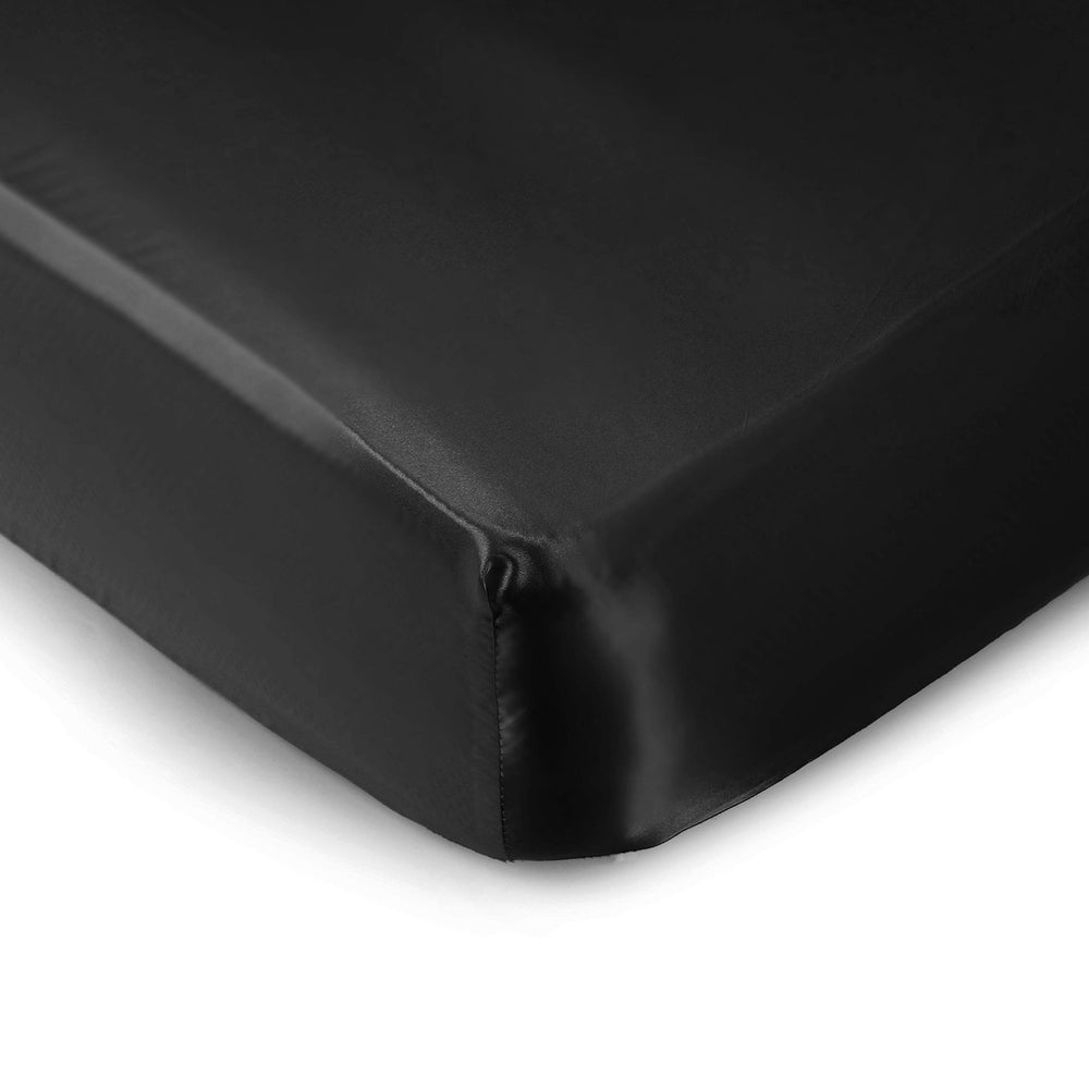 Pro Goleem satin-soft crib sheet fabric closeup showing silky texture for gentle hair care