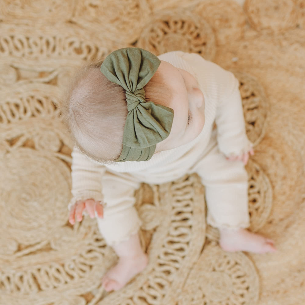 Prohouse one-size-fits-all headbands stretching over growing infant to toddler.