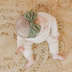 Prohouse one-size-fits-all headbands stretching over growing infant to toddler.