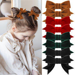 ProSuites red velvet hair bow ready to elevate festive outfits.