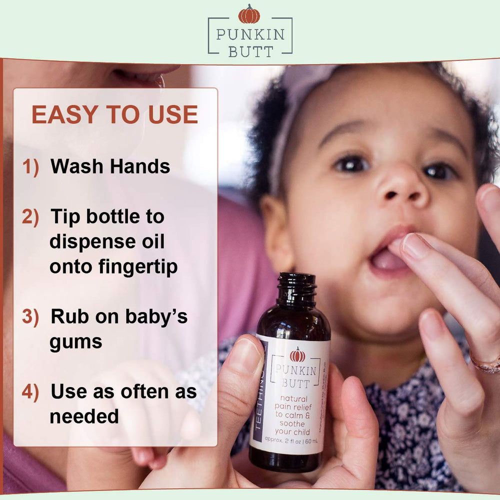 Punkin Butt teething oil baby smile after gum massage