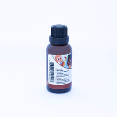 Punkin Butt teething oil on finger massaging infant gums for comfort
