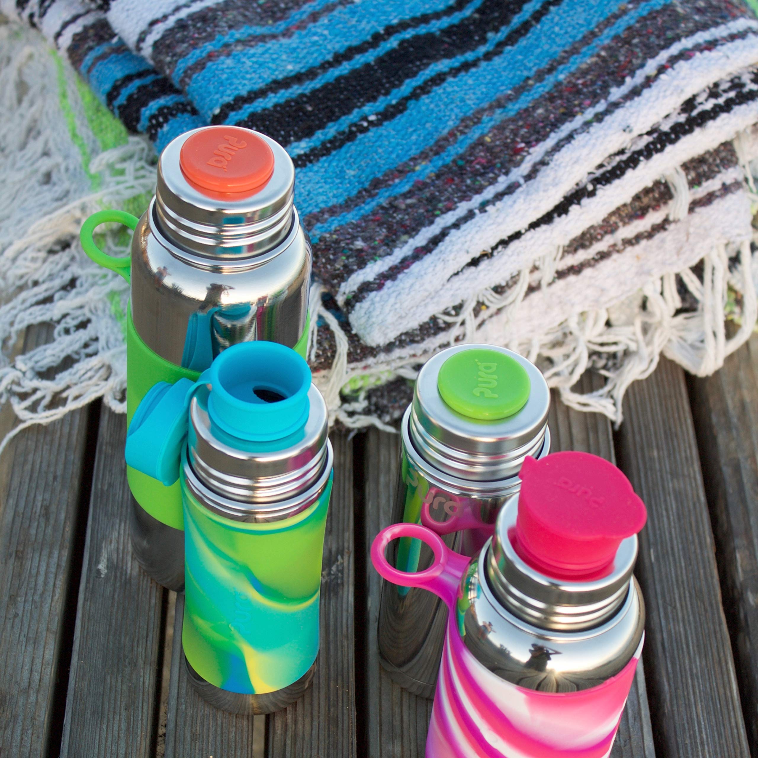 Pura Sport Mini kid use scenario shows a child using the bottle outdoors.