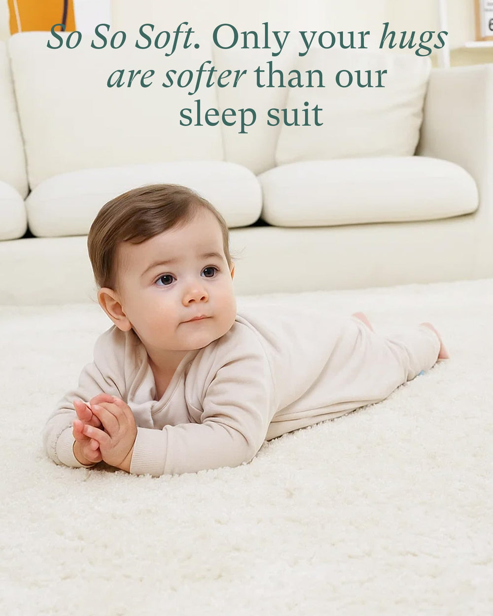 PurComfy Supersoft Sleepsuit coral with baby peacefully sleeping.