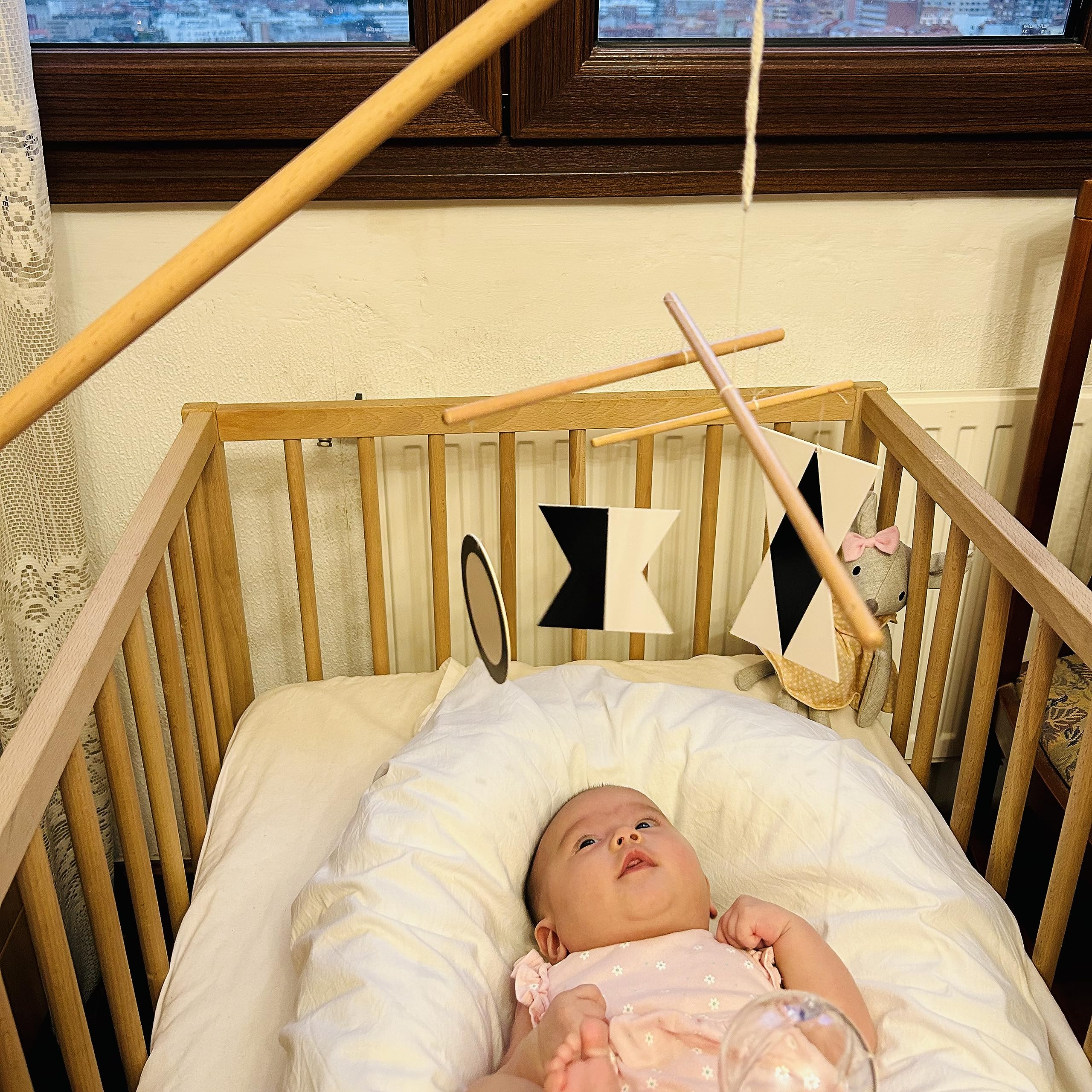 Purgano Montessori Mobile Octahedron dances above crib to support focused visual tracking