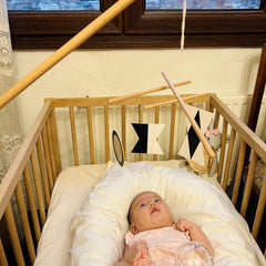 Purgano Montessori Mobile Octahedron dances above crib to support focused visual tracking