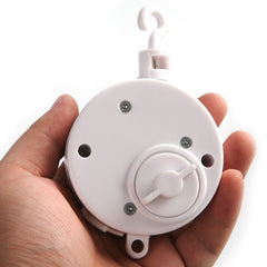 Pursuestar wind-up mechanism close-up—no batteries required for simple, reliable operation.