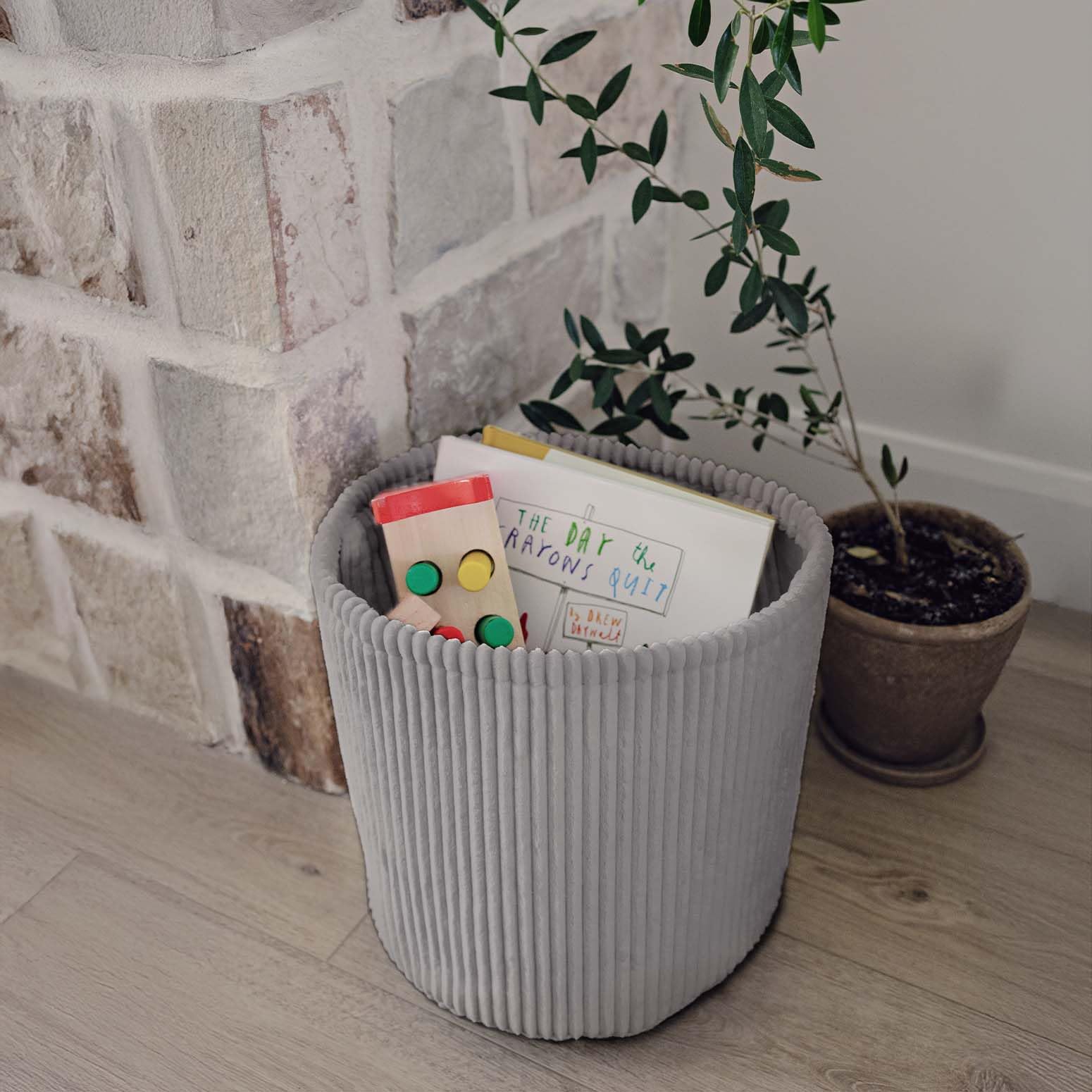 PUTSKA Blanket Basket living room display illustrates decorative yet functional organization