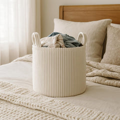 PUTSKA Blanket Basket round cream with pillows demonstrates versatile living room decor