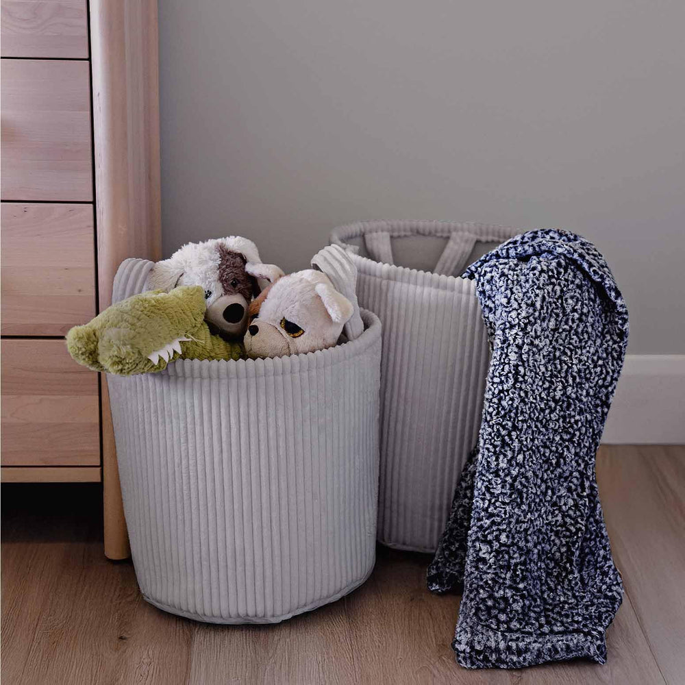 PUTSKA Blanket Basket round side view highlights easy-carry handles for moving between rooms