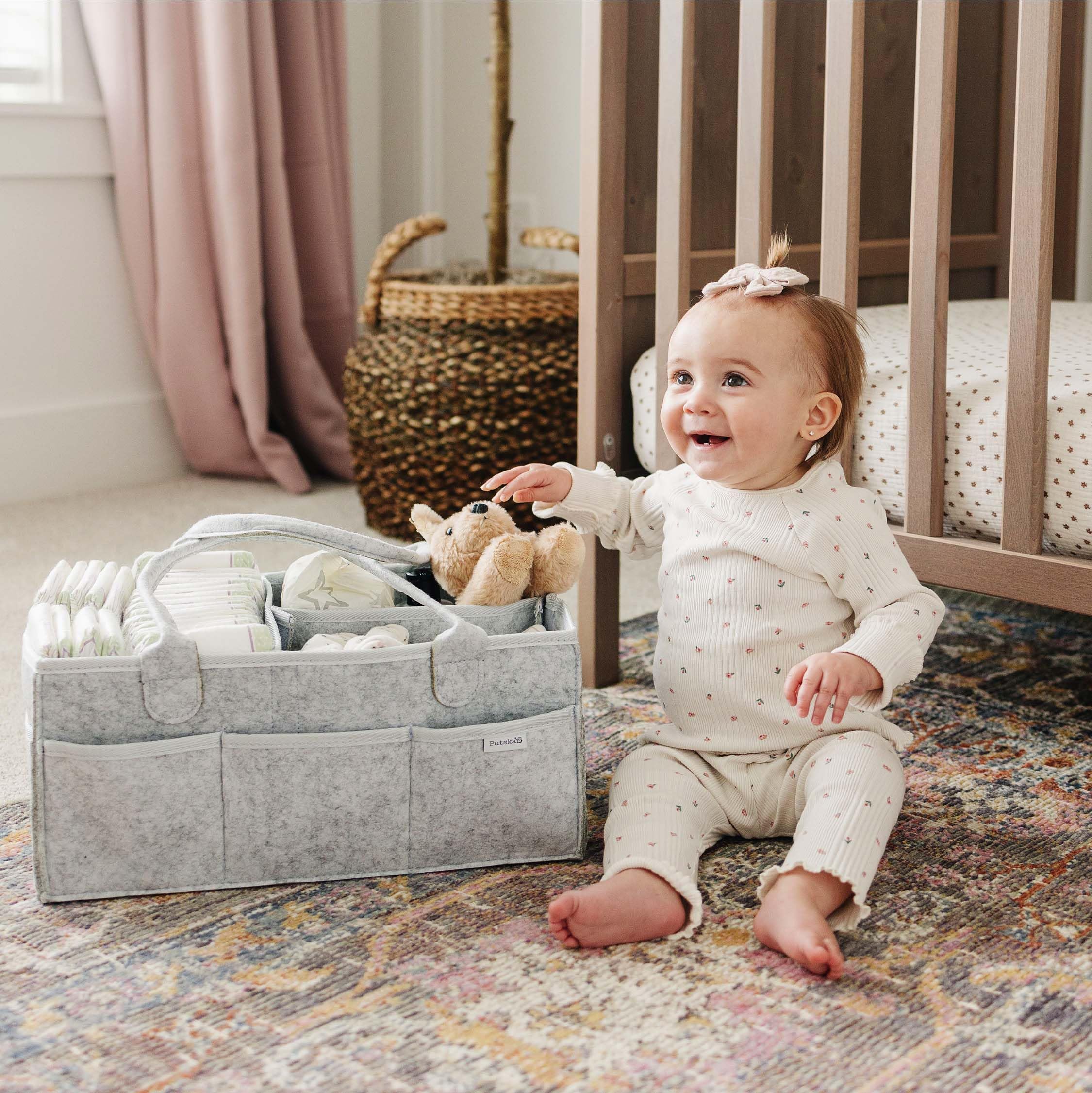 Putska diaper caddy helps stylishly organize nursery with 8 pockets.