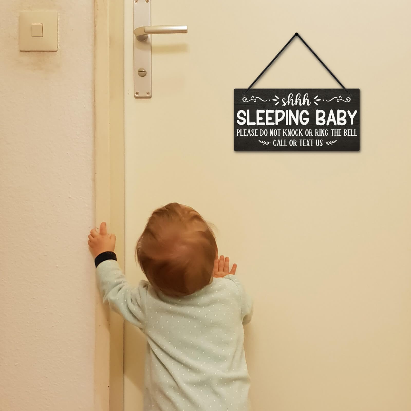 Putuo Decor baby room sign welcomes and signals private time.