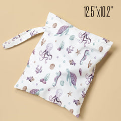 Pykfrhh Wet Bag with swimsuits organized during beach trip.
