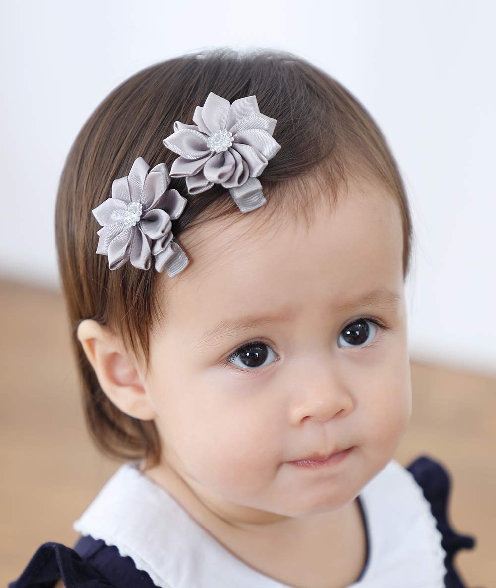 QandSweet rhinestone flower barrettes close-up with crystals.