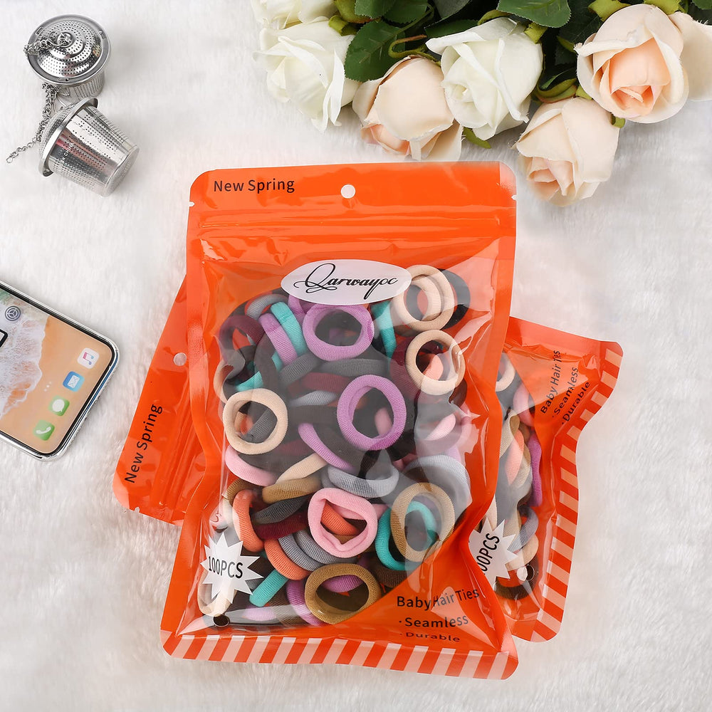 Qarwayoc hair ties in-use child ponytail, secure hold during playtime with minimal slipping.