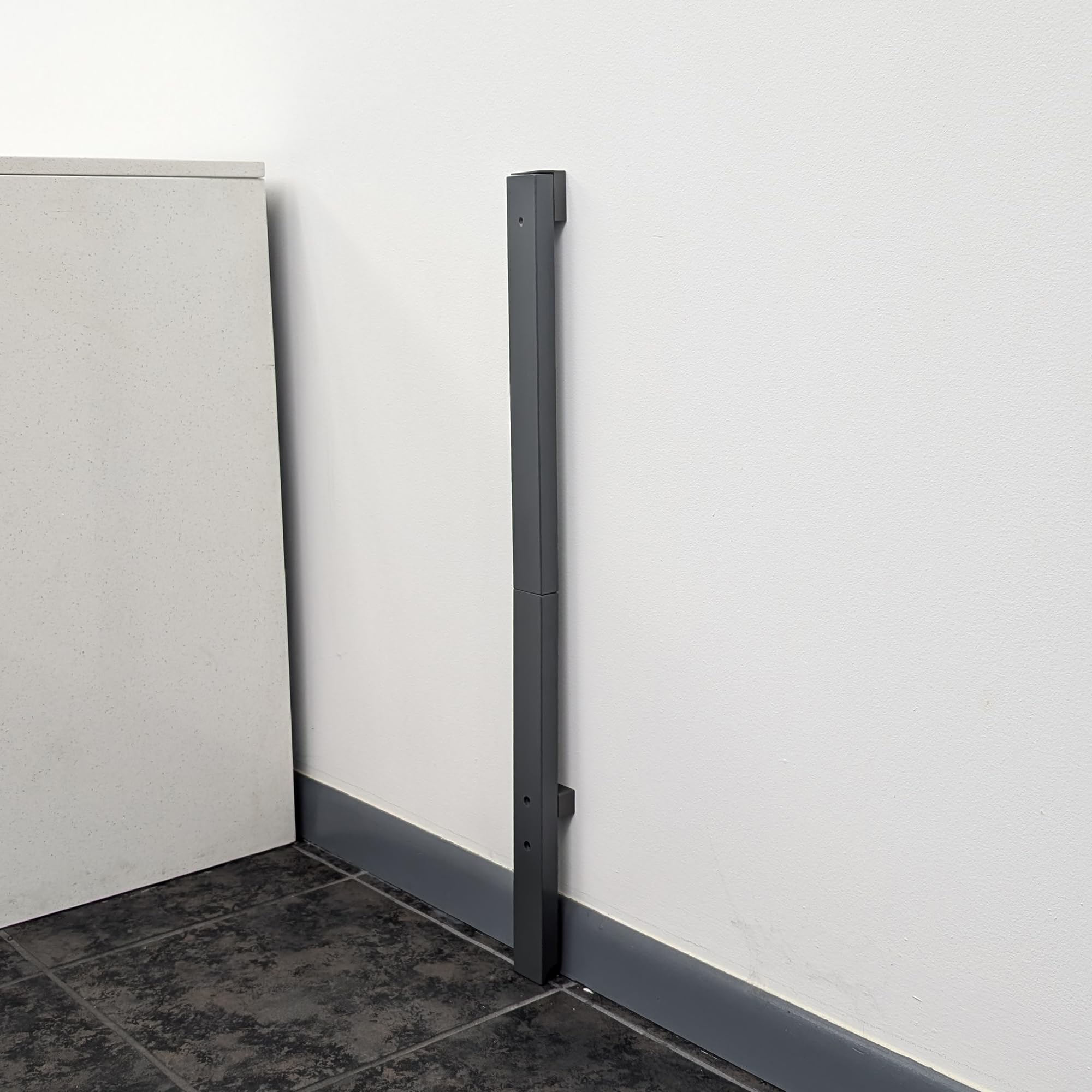 QDOS baseboard adapter slate enables universal gate mounting over baseboards.