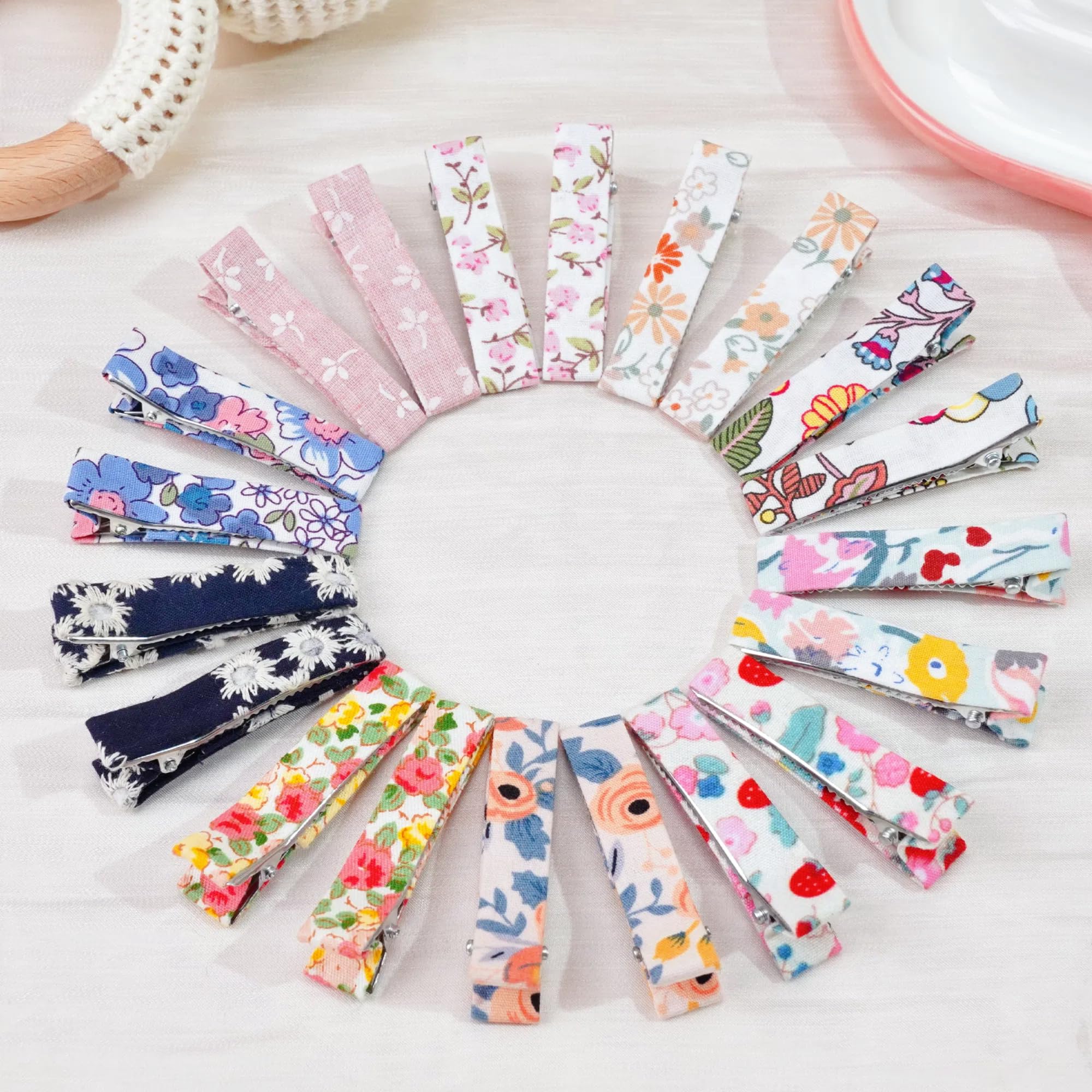 Qearl flower fabric hair clips closeup showing fully lined construction for secure wear.