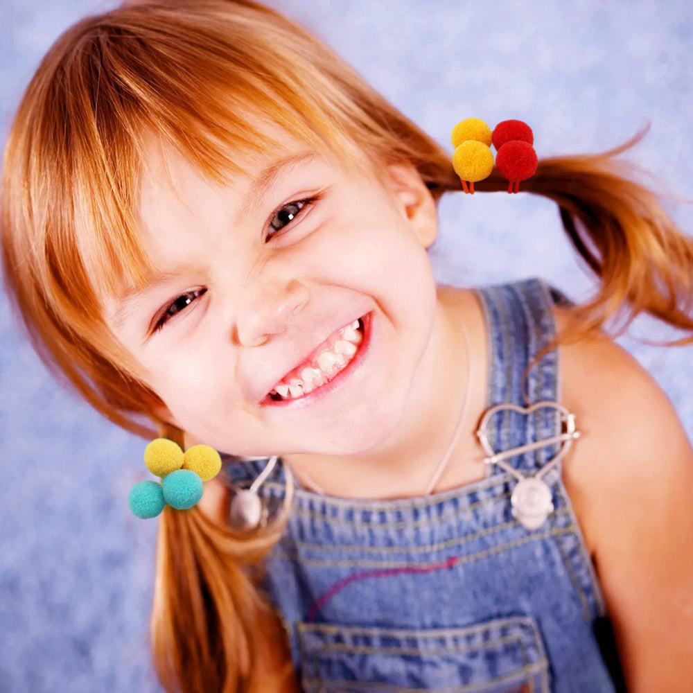Qearl pom pom velvet on child ponytail demonstrates secure yet comfy hold.