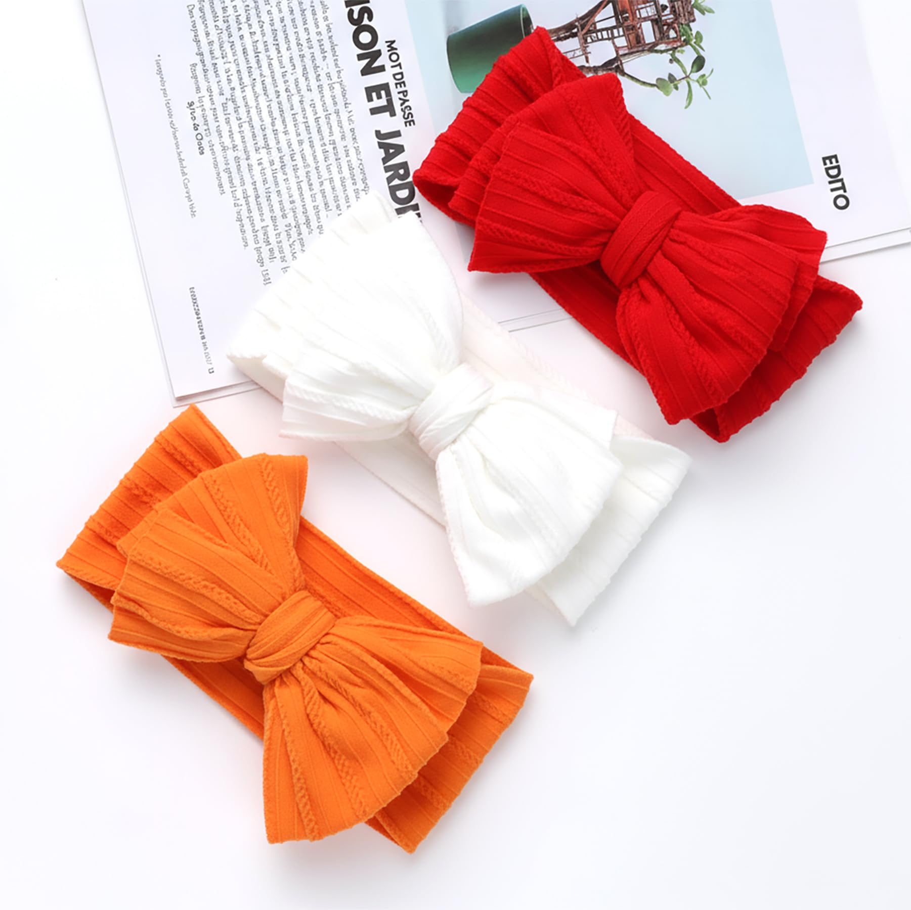 QFV red-white-orange bows display ready to pair with festive outfits.