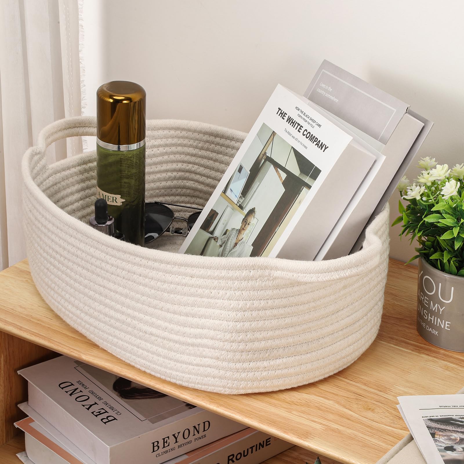 QiANBiRD organizational basket for toys and towels keeps shelves tidy.