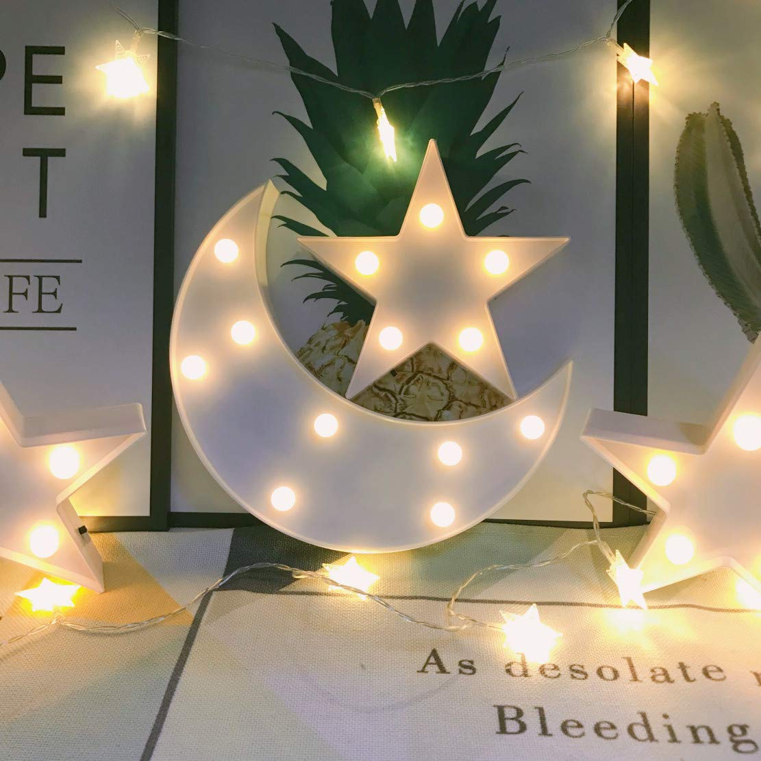 QiaoFei moon-star light adds cozy ambience to living rooms.