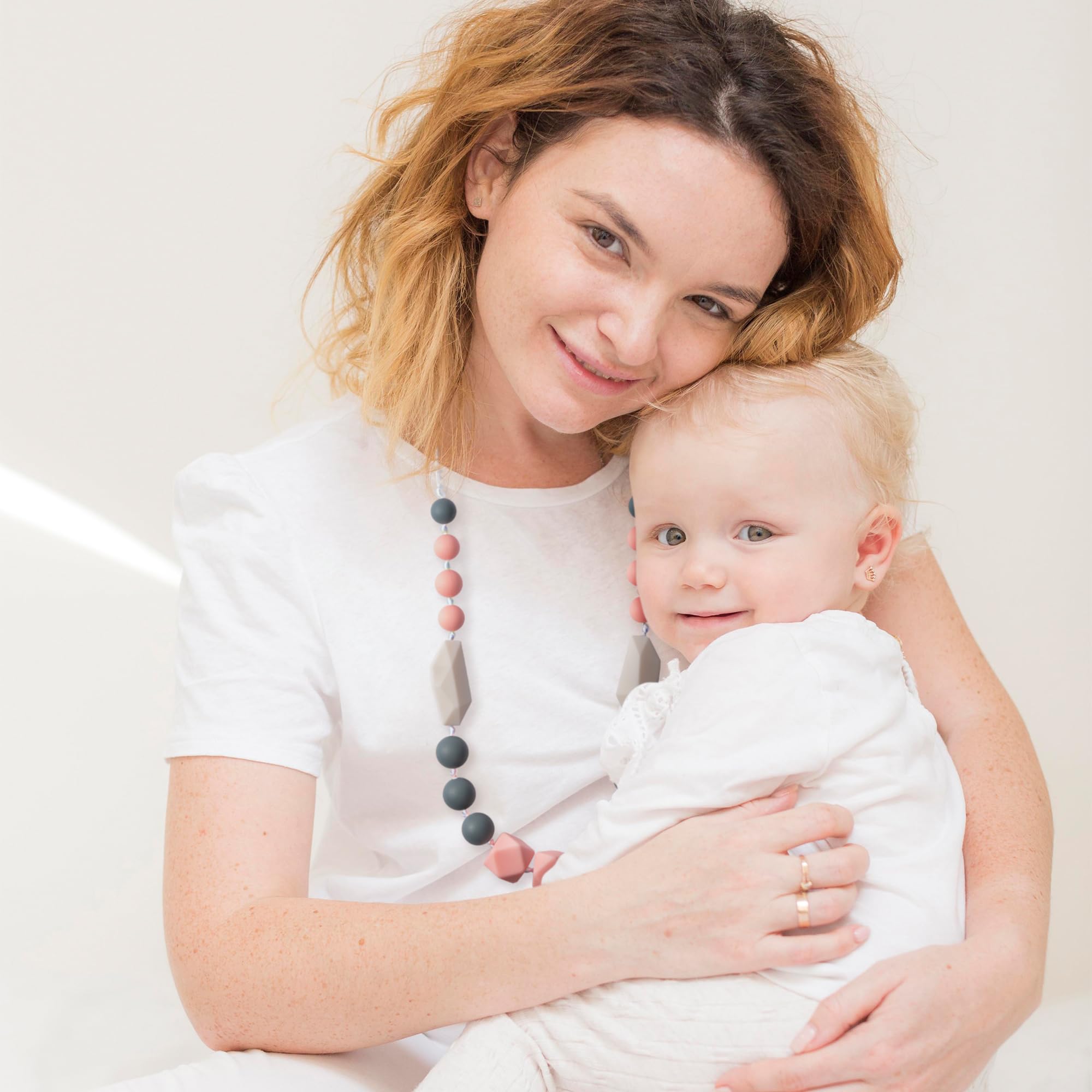 QIMGIC teething jewelry gift idea for baby showers and birthdays.
